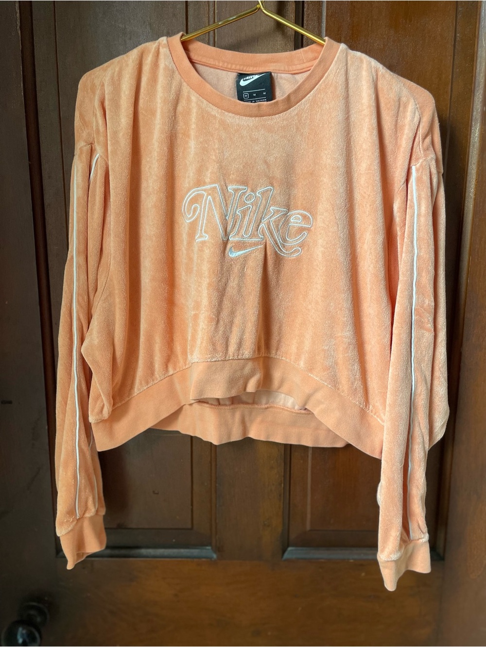 Nike women's medium orange terry cloth sweatshirt